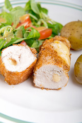 Kiev cutlet with jacket potatoes and salad