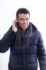 Man in jacket talking on phone