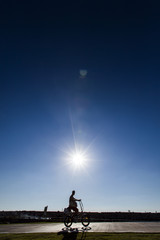 Passing Silhouette on Park Path
