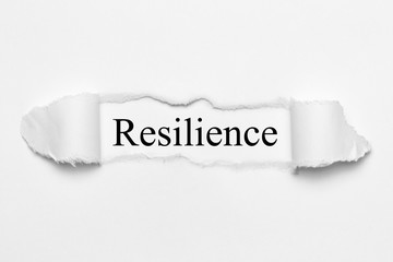 Resilience on white torn paper