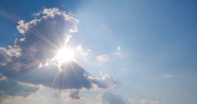 the sun's rays make their way from behind the clouds