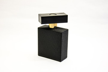 Black perfume bottle on a white background