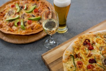Italian pizza served with a beer glass