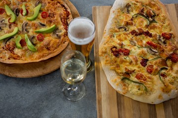 Italian pizza served with a beer glass
