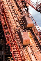Ironworks. Bucket with ore. Trolley for lifting the ore in a blast furnace