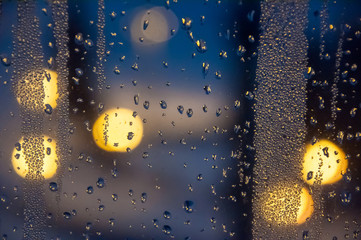 Condenced water drops on a blurred background with lights