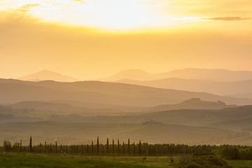 Fototapeta premium Sunset over the rolling Tuscan landscape