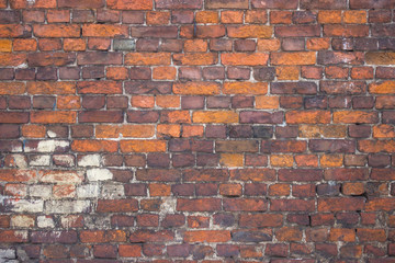 red brick wall, urban exterior, ancient weathered surface
