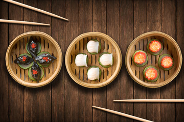 Dim Sum dumplings on a wooden background - obrazy, fototapety, plakaty