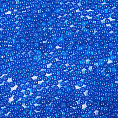 Surface coated with blue beads