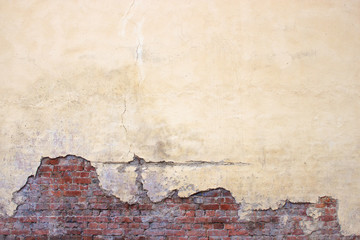 Old brick wall with peeling plaster, grunge background - obrazy, fototapety, plakaty