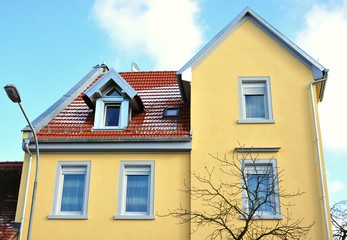 Renovated House-Front with Dormer Windows (Gauben) at tiled Roof (Ziegeldach)