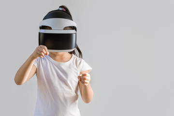 Child with Virtual Reality, VR, Headset Studio Shot Isolated on White Background. Kid Exploring Digital Virtual World with VR Goggles.