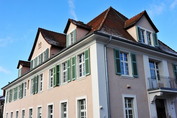 Fototapeta na wymiar Renovated House-Front with Dormer Windows (Gauben) at tiled Roof (Ziegeldach)