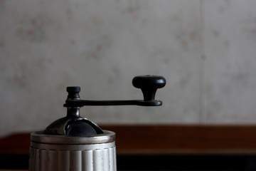 Vintage habdle of rustic, coffee, sugar and pepper mill  in old style
