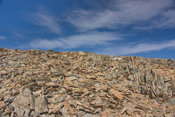 talus of sharp stones against the background of the sky