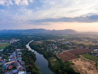 Small  tranquilly village  and carve of river at sunset