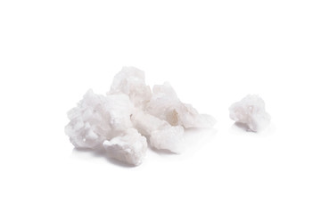 Organic sea white salt tablets ioslated on white background.
