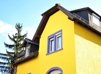 Renovated House-Front with Dormer Windows (Gauben) at tiled Roof (Ziegeldach)