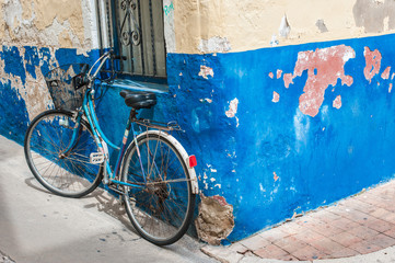 Blue bicycle on the wall
