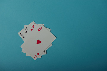 A winning poker hand of four aces playing cards