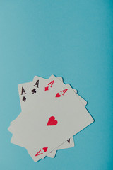 A winning poker hand of four aces playing cards