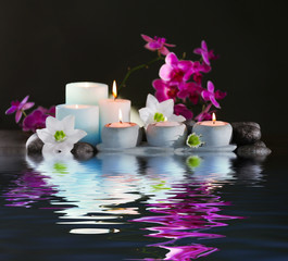Beautiful spa composition with reflection on water surface