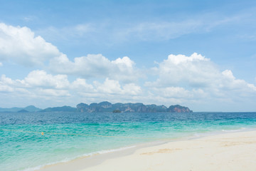 Fototapeta na wymiar Touring boat landed on the white tropical beach of Poda island, Krabi,Thailand.