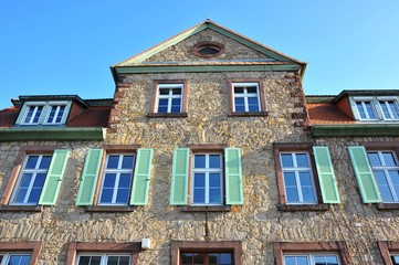 Naklejka premium Renovated House-Front with Dormer Windows (Gauben) at tiled Roof (Ziegeldach)