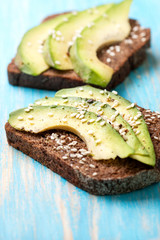 toast with slices of avocado and spices