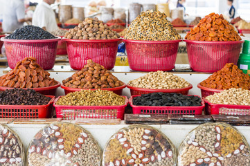 The stall with dried fruits at the Siab Dekhkhan Bazaar offers different raisins, apricots, prums and figs in Samarkand, Uzbekistan