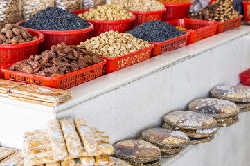 The stall with dried fruits at the Siab Dekhkhan Bazaar offers different raisins, apricots, prums and figs in Samarkand, Uzbekistan