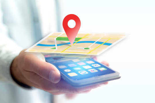 Vuiew of a Concept of geographical localization on a map with a smartphone