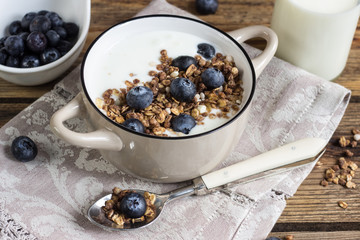 Healthy breakfast with yogurt, granola and fresh blueberry.