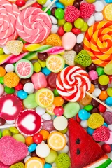Foto auf Acrylglas Süßigkeiten Bunte Lutscher und Süßigkeiten. Ansicht von oben.
