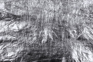crumpled silver aluminum foil background, abstract texture