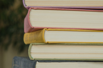 a stack of colorful books in a library