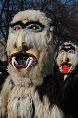 Pernik, Bulgaria - January 28, 2017 - Masquerade festival Surva in Pernik, Bulgaria. People with mask called Kukeri dance and perform to scare the evil spirits