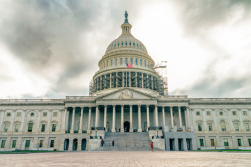 Obraz premium WASHINGTON DC, USA The United States Capitol view from the street. In 2014, scaffolding was erected around the dome for a restoration project scheduled to be completed by 2017. 