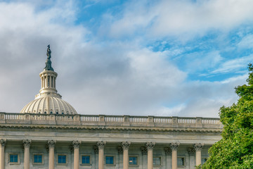 Obraz premium WASHINGTON DC, USA The United States Capitol view from the street. In 2014, scaffolding was erected around the dome for a restoration project scheduled to be completed by 2017. 