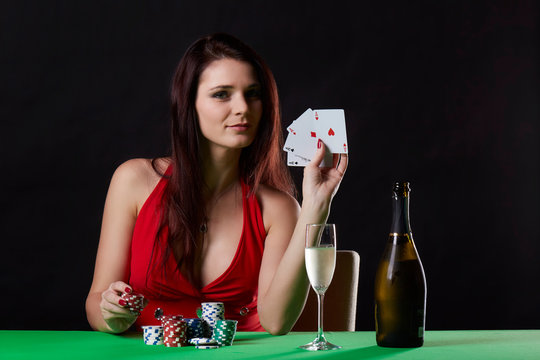 Very beautiful woman playing texas hold'em poker