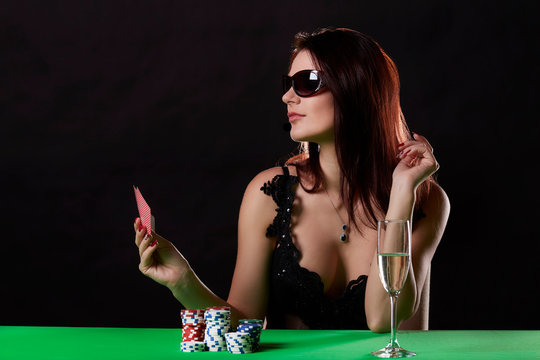 Very beautiful woman playing texas hold'em poker