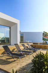 Fototapeta premium Modern house with garden swimming pool and wooden deck