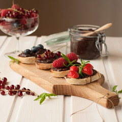 Toasts with chocolate and berries