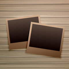 old photo frames on wooden background