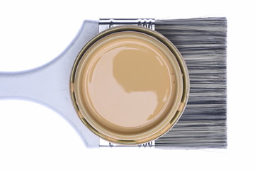 Paintbrush and Can Lid with Creme Color Paint Isolated on White Background, Top View