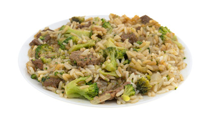 Beef broccoli and rice dinner on a plate isolated on a white background.