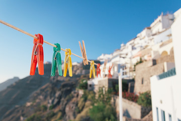 Shallow depths of field with colorful pegs and Santorini in the
