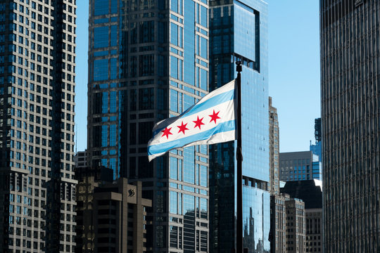 Flag of Chicago surrounded by the downtown's skyscrapers