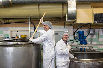 production of cheese in  dairy,  two worker